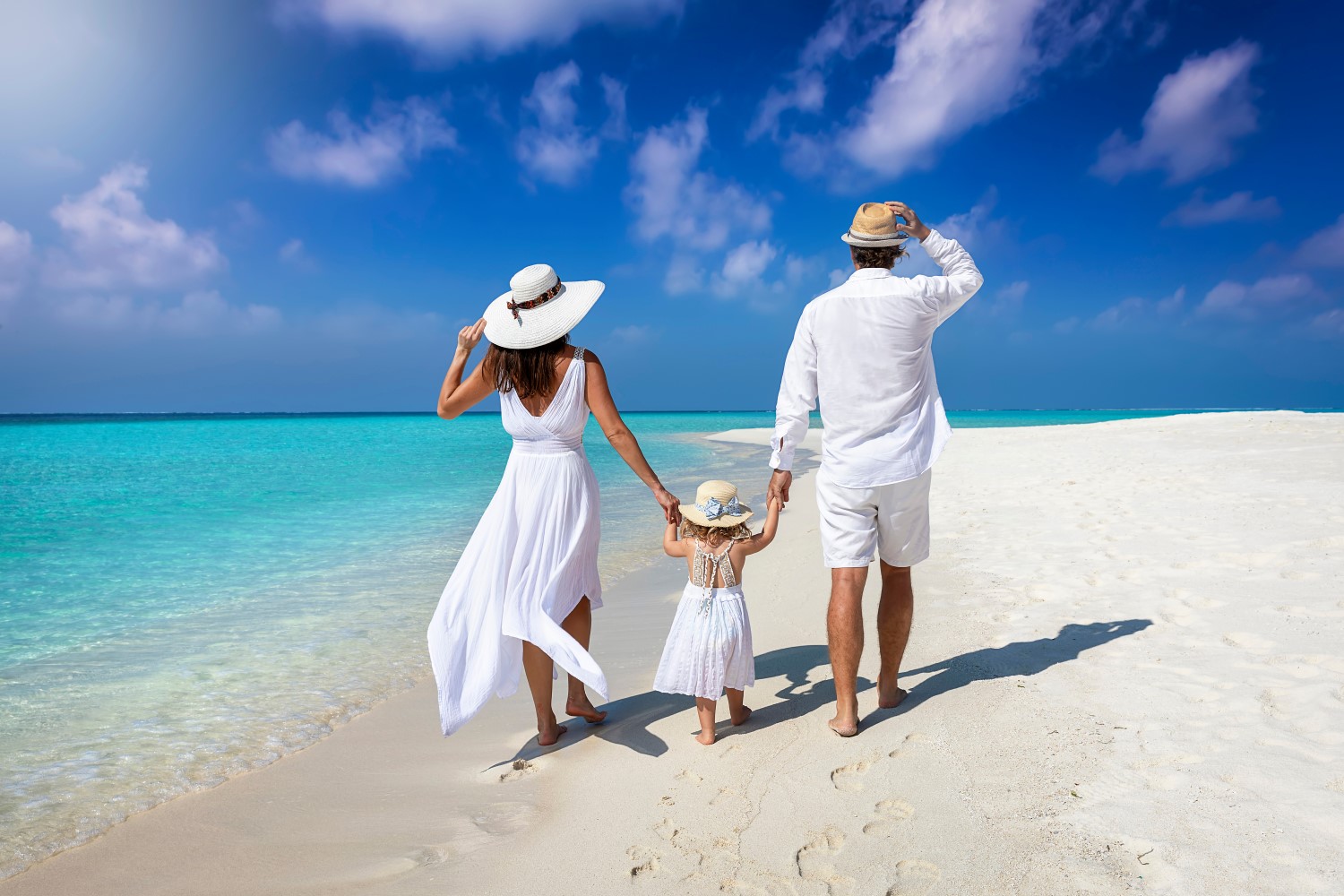 A elegant family in white summer clothing