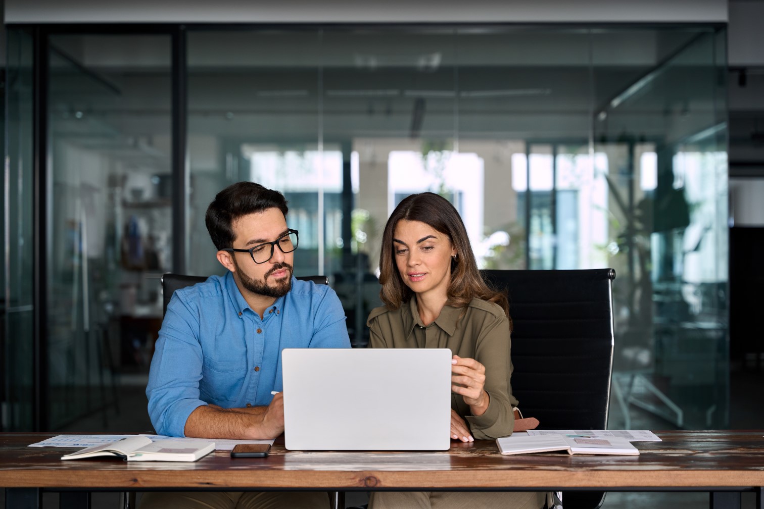 Mature executive manager talking to colleague
